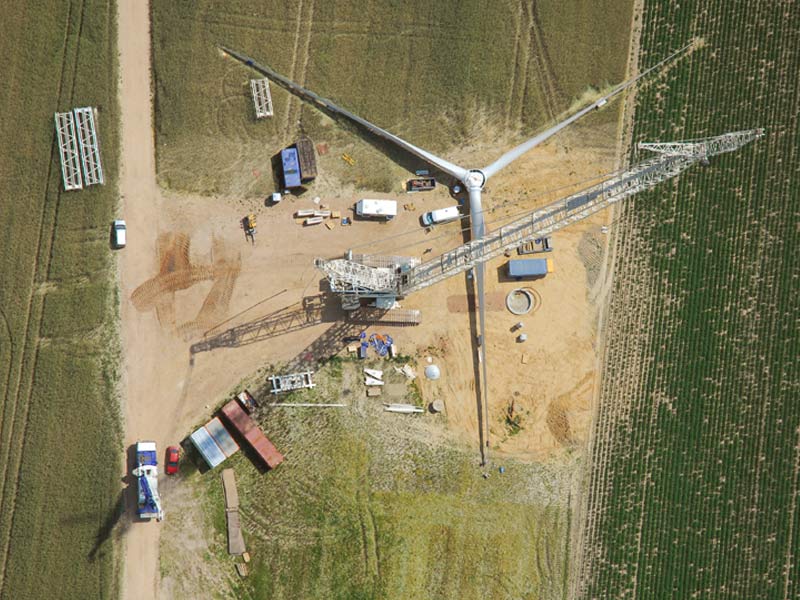 The aerial photograph shows the construction of the one hundredth wind power plant in Danna